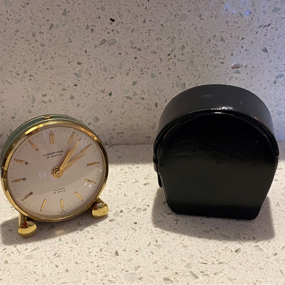 Vintage LOOPING Alarm Travel Clock 1950s In Mint Condition with original case.
